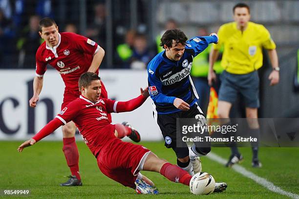 Markus Steinhoefer of Kaiserslautern tackles Kevin Kerr of Bielefeld during the Second Bundesliga match between Arminia Bielefeld and 1. FC...