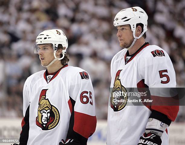 Erik Karlsson and Andy Sutton of the Ottawa Senators look on during play against the Pittsburgh Penguins in Game Two of the Eastern Conference...
