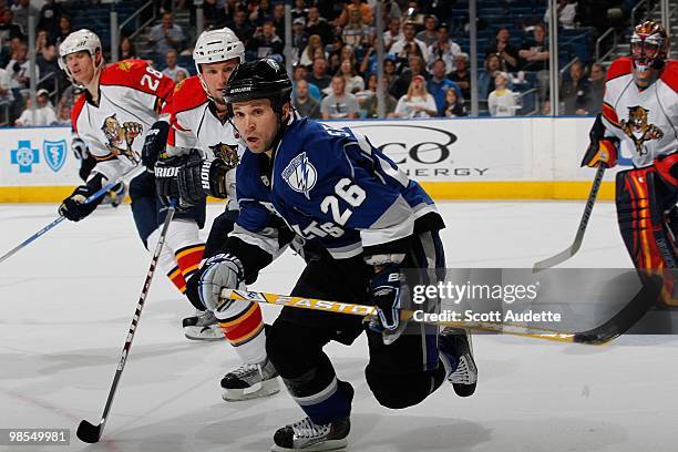 Martin St. Louis of the Tampa Bay Lightning skates to the puck against the Florida Panthers at the St. Pete Times Forum on April 10, 2010 in Tampa,...