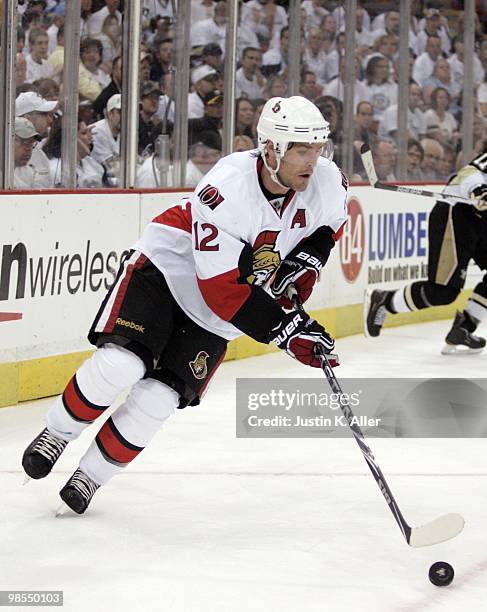 Mike Fisher of the Ottawa Senators handles the puck against the Pittsburgh Penguins in Game Two of the Eastern Conference Quarterfinals during the...