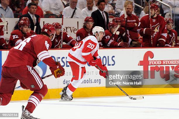 Drew Miller of the Detroit Red Wings skates the puck up ice against the Phoenix Coyotes in Game Two of the Western Conference Quarterfinals during...