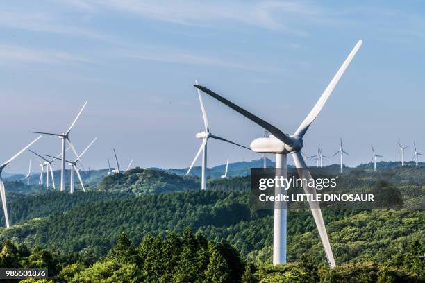 windmills for wind power generation - wind power japan stock pictures, royalty-free photos & images