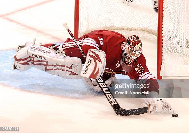 Goaltender Ilya Bryzgalov of the Phoenix Coyotes dives to cover up the puck against the Detroit Red Wings in Game Two of the Western Conference...