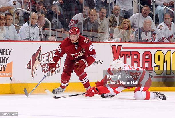 Wojtek Wolski of the Phoenix Coyotes and Darren Helm of the Detroit Red Wings fight for the puck in Game Two of the Western Conference Quarterfinals...