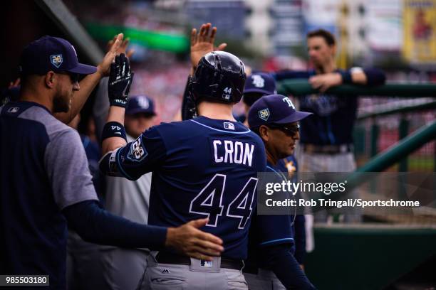 Cron of the Tampa Bay Rays gets greeted by his teammates after hitting a home run during the game against the Washington Nationals at Nationals Park...