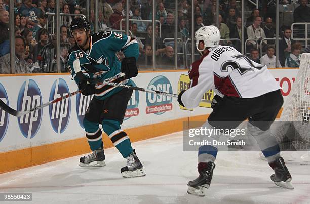 Kyle Quincey of the Colorado Avalanche tries to block the pass from Devin Setoguchi of the San Jose Sharks in Game One of the Western Conference...
