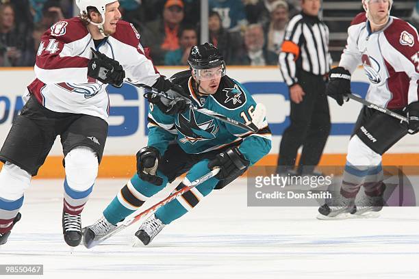 Ryan Wilson of the Colorado Avalanche and Devin Setoguchi of the San Jose Sharks race toward the puck in Game One of the Western Conference...