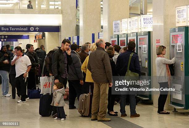 Passengers queue up for tickets at a ticket office at Milano Centrale train station on April 19, 2010 in Milan, Italy. Passengers are looking for...