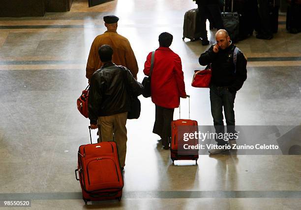 People walk in the Milano Centrale train station on April 19, 2010 in Milan, Italy. Passengers are looking for alternative routes to return home...