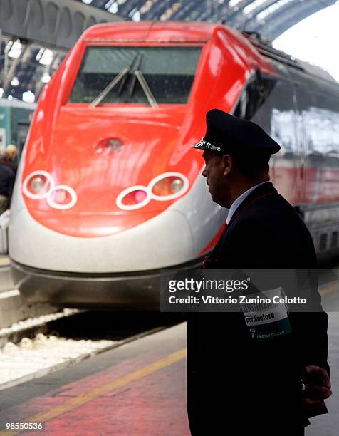 Train conductor looks at a train at Milano Centrale train station on April 19, 2010 in Milan, Italy. Passengers are looking for alternative routes to...