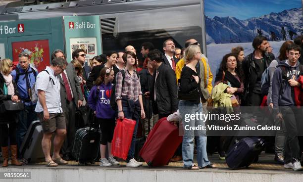 Passengers wait for a train to depart to Rome at Milano Centrale train station on April 19, 2010 in Milan, Italy. Passengers are looking for...