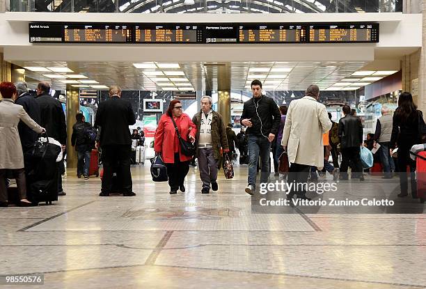 People walk in Milano Centrale train station on April 19, 2010 in Milan, Italy. Passengers are looking for alternative routes to return home after...