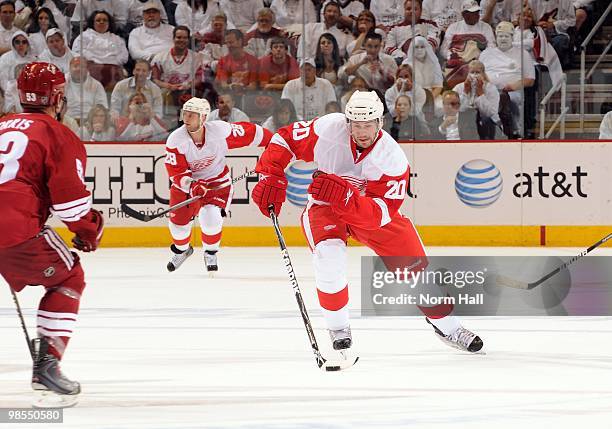 Drew Miller of the Detroit Red Wings skates the puck up ice against the Phoenix Coyotes in Game Two of the Western Conference Quarterfinals during...