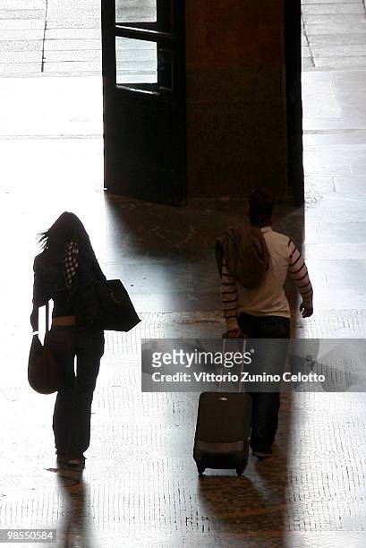 People walk in Milano Centrale train station on April 19, 2010 in Milan, Italy. Passengers are looking for alternative routes to return home after...