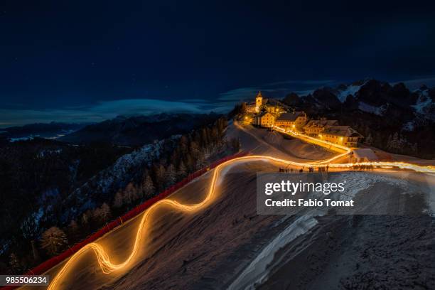 fiaccolata monte lussari - tomat stock pictures, royalty-free photos & images