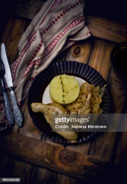 confit from a duck, stewed sauerkraut and mashed potatoes. - mashed stock pictures, royalty-free photos & images