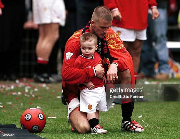 David Beckham with Brooklyn aftre the FA Carling Premiership match between Manchester United and Derby County at Old Trafford, Manchester. Mandatory...