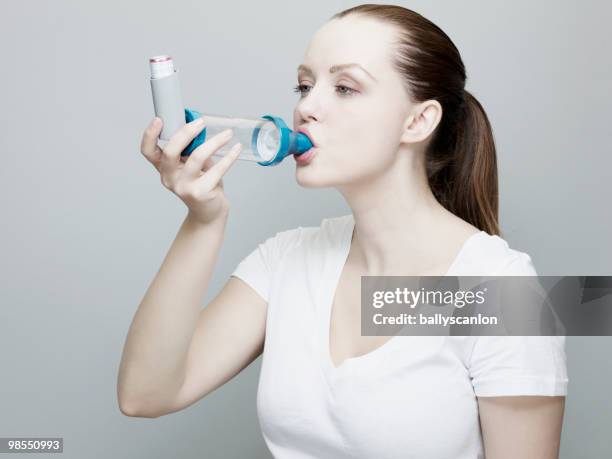 Person Using An Inhaler Asthma Inhaler And Spacer Photos and Premium High Res Pictures - Getty ...