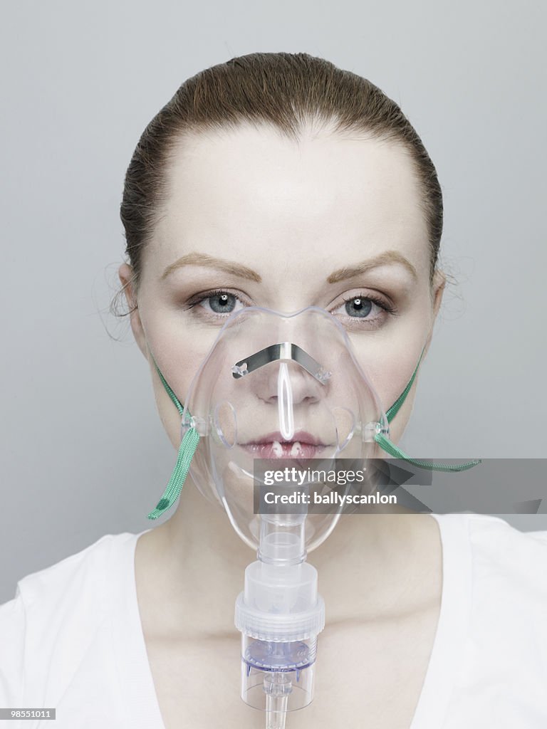 Woman Wearing An Oxygen Mask.