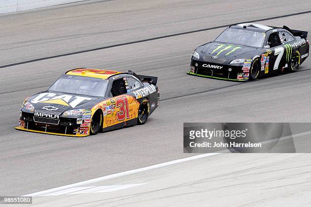 Jeff Burton, driver of the Caterpillar Chevrolet, leads Robby Gordon, driver of the Monster Energy Toyota, during the NASCAR Sprint Cup Series...