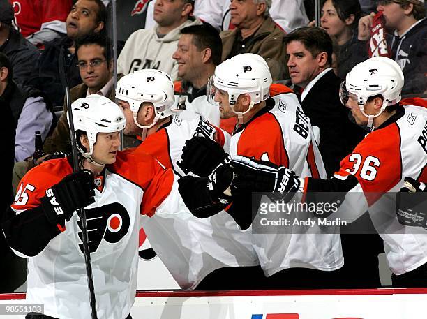 Arron Asham of the Philadelphia Flyers is congratulated after scoring a goal against the New Jersey Devils in Game Two of the Eastern Conference...