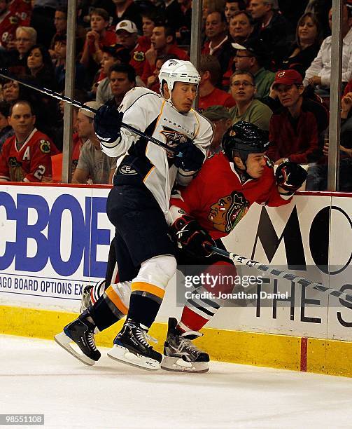 Jordin Tootoo of the Nashville Predators collides with Niklas Hjalmarsson of the Chicago Blackhawks in Game One of the Western Conference...