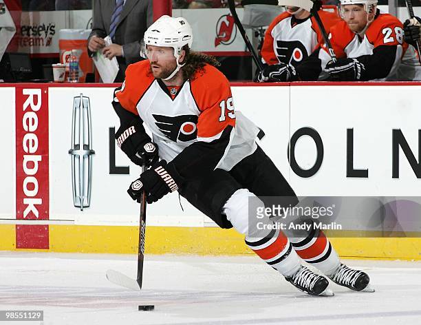 Scott Hartnell of the Philadelphia Flyers plays the puck against the New Jersey Devils in Game Two of the Eastern Conference Quarterfinals during the...