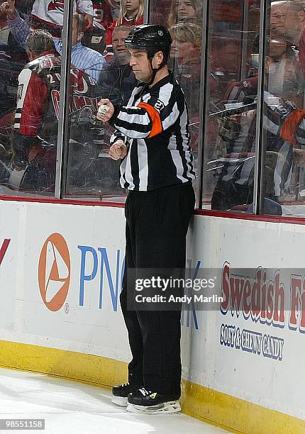 Referee Eric Furlatt calls a hooking penalty during the game between the Philadelphia Flyers and the New Jersey Devils in Game Two of the Eastern...