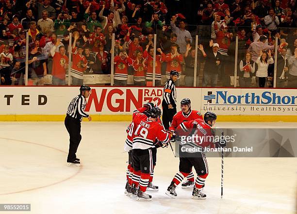 Members of the Chicago Blackhawks including Jonathan Toews, Niklas Hjalmarsson and Brent Sopel celebrate a second period goal against the Nashville...