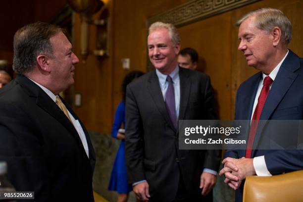 Secretary of State Mike Pompeo speaks to Sen. Chris Van Hollen , center, and Senate Appropriations Subcommittee on Sate, Foreign Operations, and...