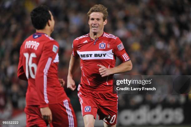 Brian McBride of Chicago Fire celebrates the game's winning goal with Marco Pappa against D.C. United at RFK Stadium on April 17, 2010 in Washington,...