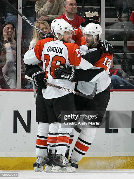 Claude Giroux of the Philadelphia Flyers celebrates with his teammates after scoring a goal against the New Jersey Devils in Game Two of the Eastern...