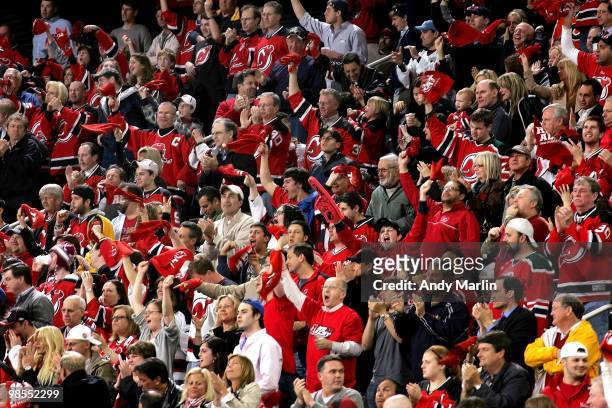 Fans of the New Jersey Devils celebrate a Devils goal against the Philadelphia Flyers in Game Two of the Eastern Conference Quarterfinals during the...