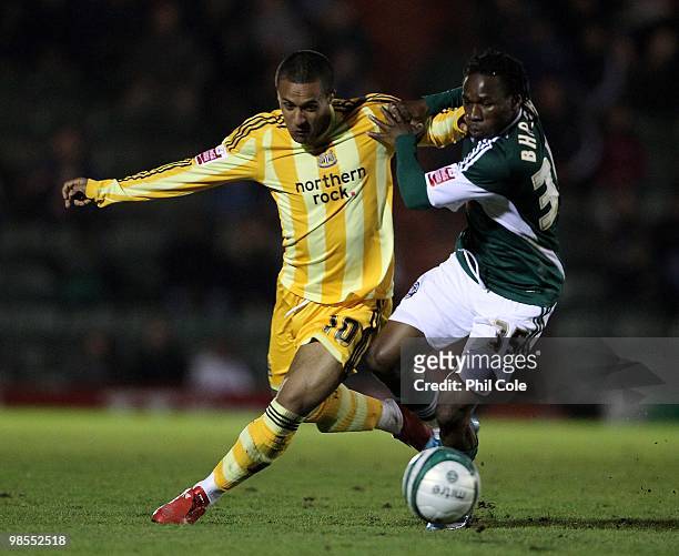 Wayne Routledge of Newcastle United competes for the ball with Onismor Bhasera of Plymouth Argyle during the Coca Cola Championship match between...