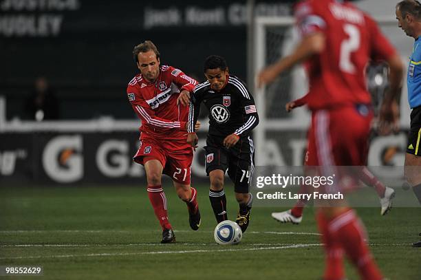 Andy Najar of D.C. United dribbles the ball past Justin Mapp of Chicago Fire at RFK Stadium on April 17, 2010 in Washington, DC. The Fire defeated...