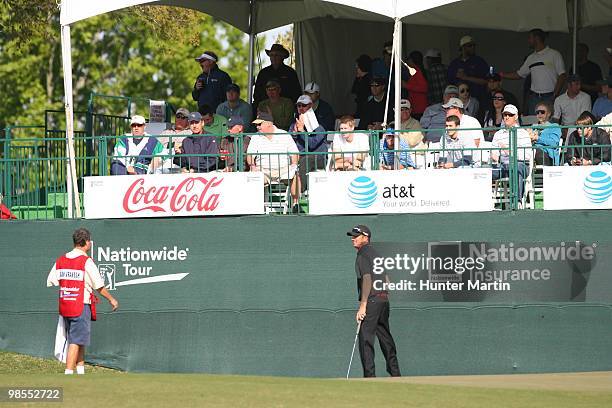 Brian Vranesh looks on alongside his caddie during the final round of the Chitimacha Louisiana Open at Le Triomphe Country Club on March 28, 2010 in...