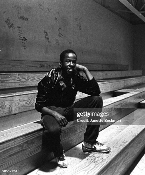 Portrait of American R&B singer Bobby Brown of the group New Edition as he sits on the bleachers in the gymnasium of Boston Technical High School ,...