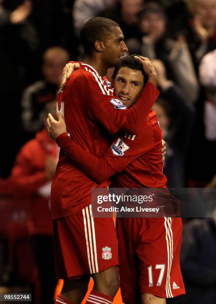 David Ngog of Liverpool is congratulated by his team mate Maxi Rodriguez after scoring his team's second goal during the Barclays Premier League...