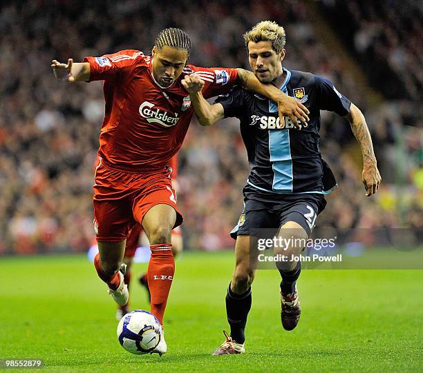 Glen Johnson of Liverpool competes with Valon Behrami of West Ham during the Barclays Premier League match between Liverpool and West ham United at...