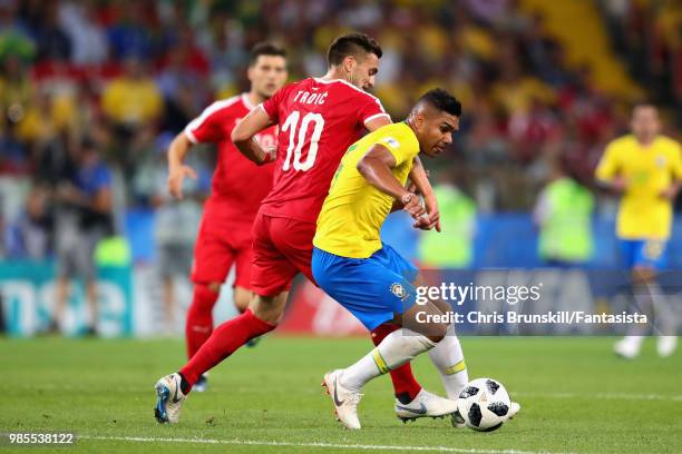 Casemiro of Brazil is challenged by Dusan Tadic of Serbia during the 2018 FIFA World Cup Russia group E match between Serbia and Brazil at Spartak...