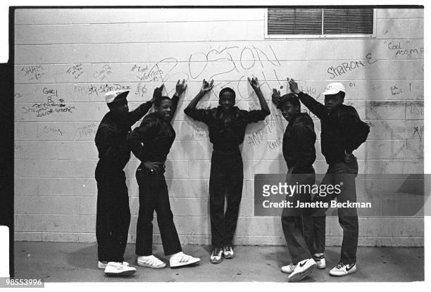 Portrait of American rhythm and blues group New Edition as they pose in the gymnasium of Boston Technical High School , Boston, Massachusetts, 1983....