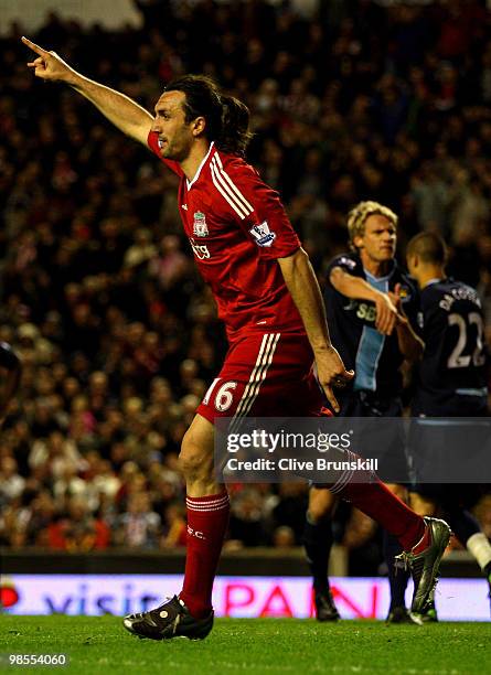 Sotiros Kyrgiakos of Liverpool celebrates scoring his team's third goal during the Barclays Premier League match between Liverpool and West Ham...