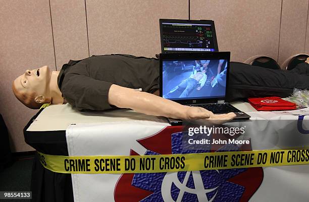 Dummy sits on display at a booth advertising college classes for first responders at the "Job Hunters Boot Camp" on April 19, 2010 in Aurora,...