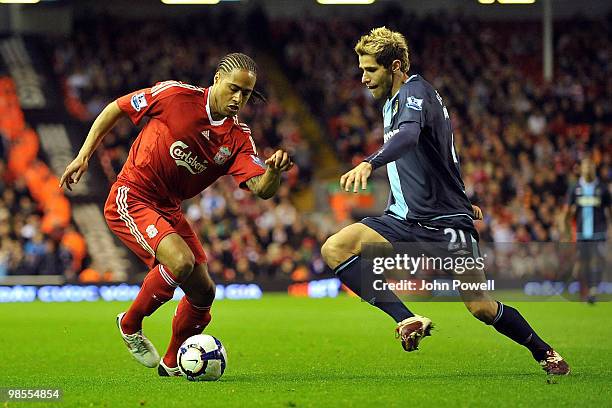 Glen Johnson of Liverpool competes with Valon Behrami of West Ham during the Barclays Premier League match between Liverpool and West ham United at...