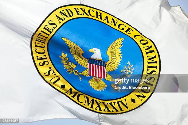 Flag bearing the logo of the U.S. Securities and Exchange Commission waves outside the agency's headquarters in Washington, D.C., U.S., on Monday,...