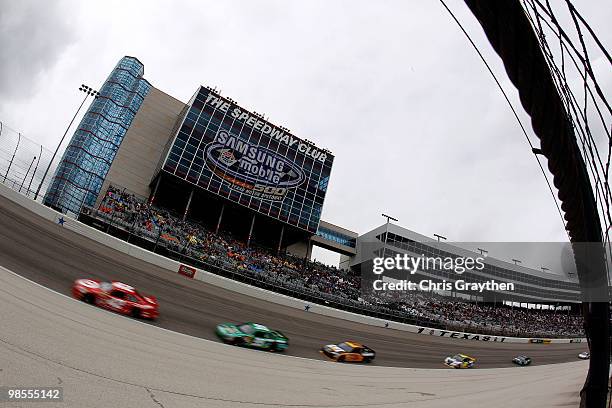 Juan Pablo Montoya, driver of the Target Chevrolet, leads a line of cars during the NASCAR Sprint Cup Series Samsung Mobile 500 at Texas Motor...