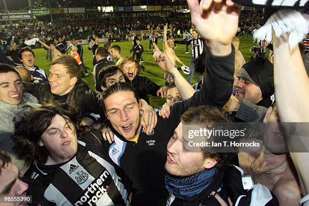Andy Carroll celebrates with fans after the Coca Cola Championship match between Plymouth Argyle and Newcastle United at the Home Park on April 19,...