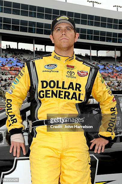 Brian Scott, driver of the Dollar General Toyota, looks on from the grid during the NASCAR Nationwide Series O'Reilly Auto Parts 300 at Texas Motor...