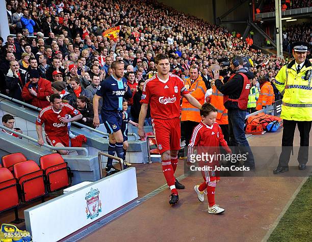 Steven Gerrard of Liverpool leads his team out during the Barclays Premier League match between Liverpool and West ham United at Anfield on April 19,...
