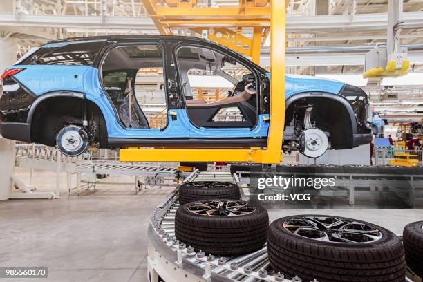 The assembly line of NIO ES8 electric vehicle is seen at a plant jointly built by Chinese automaker Anhui Jianghuai Automobile Group Corp., Ltd. And...